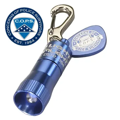 A BLUE Nano Light flashlight with a badge attached to it.